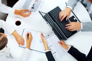 people working at a table together