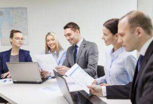 people smiling and working together