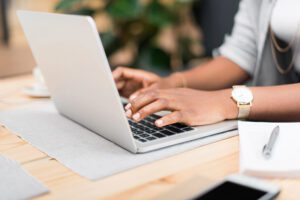 person typing on computer