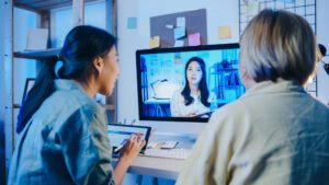 people in person woking with someone remotely