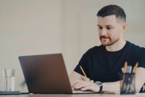 man working remotely from home
