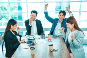 group of people in office celebrating