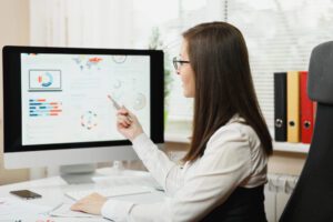 person looking at data in the computer