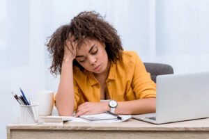 lady tired at desk