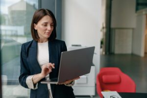 person on laptop in workplace