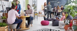 people sitting at tables working together