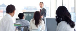 people in office looking at coworker