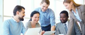 group of people smiling working together