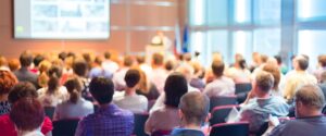 people in a conference room attending presentation