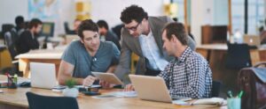 people working together looking at devices