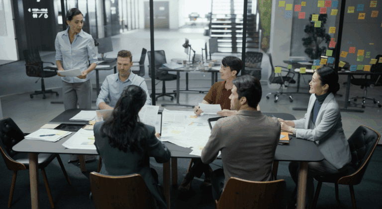 Diverse Team of Business Professionals Attending a Corporate Presentation