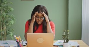 person stressed at computer